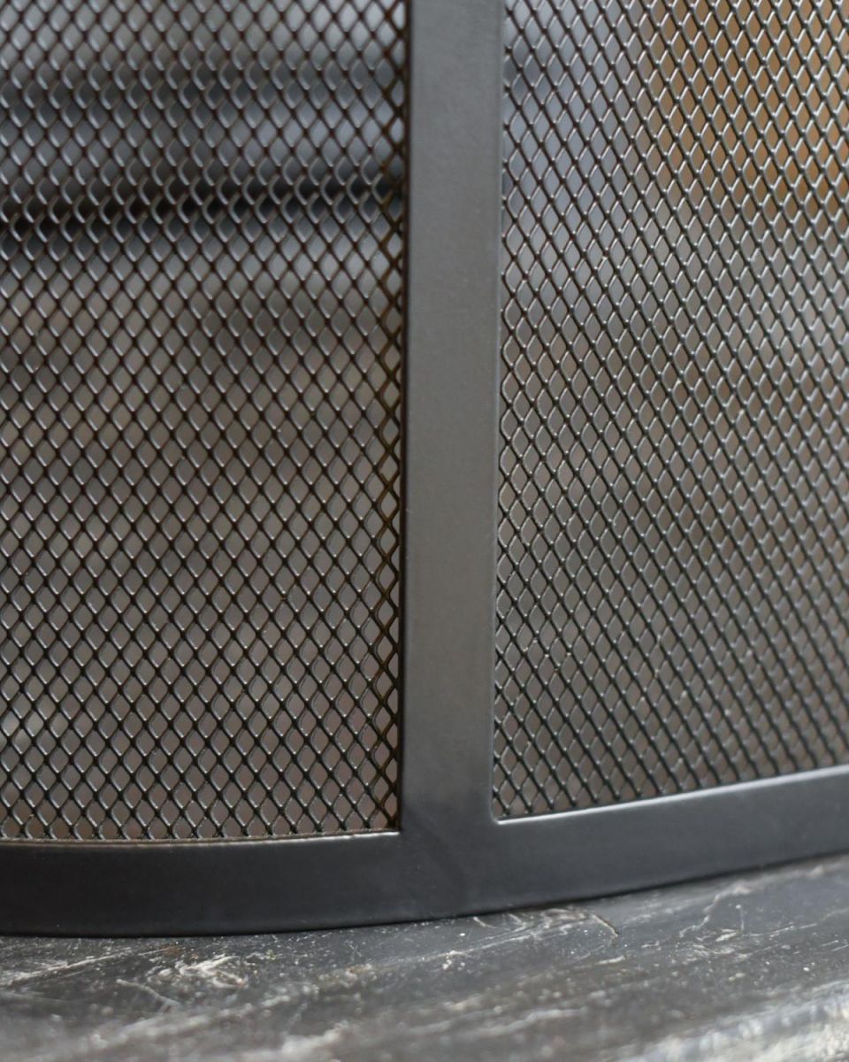 Close Up Of Classic Black Arched Fire Guard with Circular Handle Frame