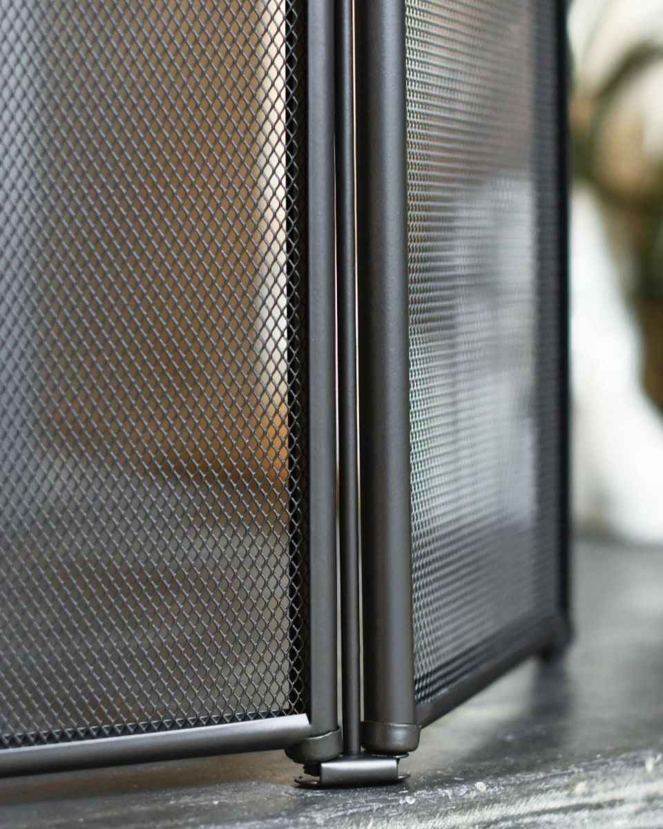 Close Up Of Classic Black Three Fold Fire Guard Frame And Mesh