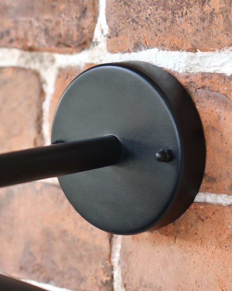 Close-up of Fixing Plate Mounted on a Brick Wall