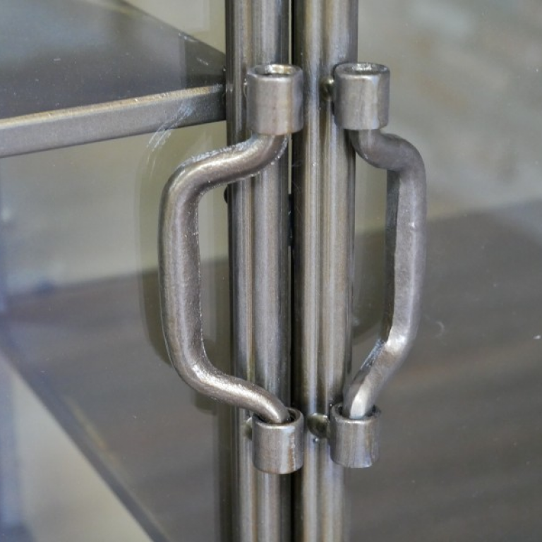 Close-up of the Metal Handles on the Cabinet Doors Close-up of the Metal Handles on the Cabinet Doors