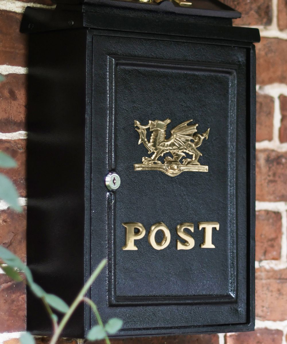 Close-up of the Polished Brass "Welsh Dragon" Design on the Front of the Post Box