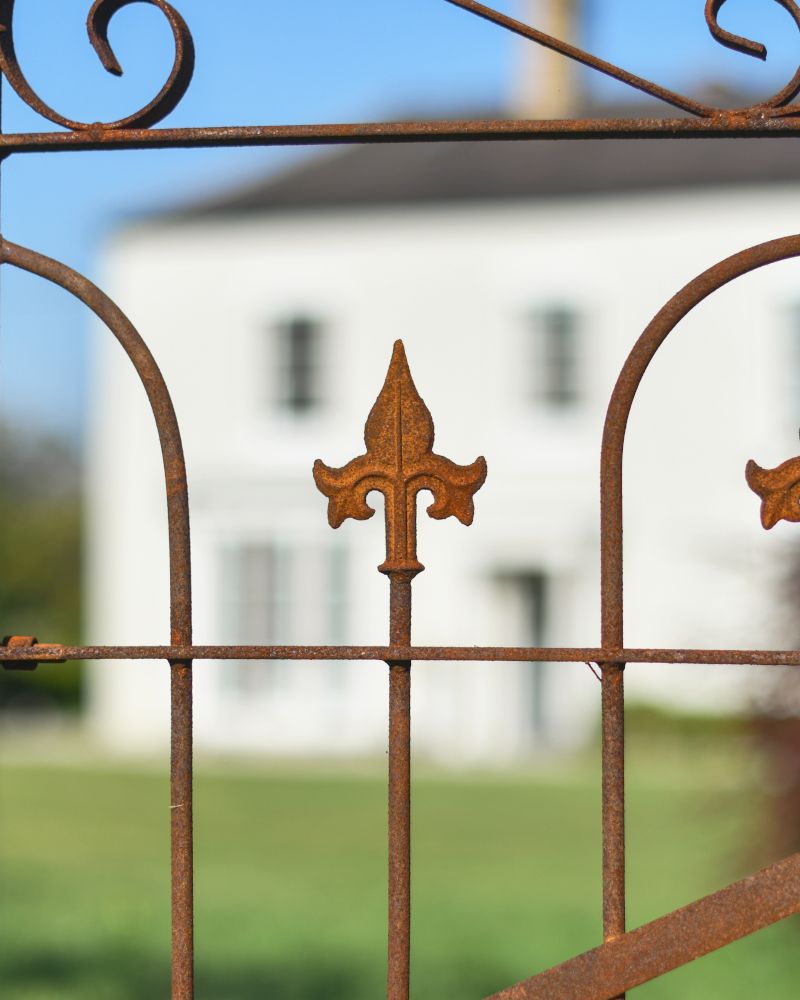 Close Up Of The Rustic Details On The Gate From The ornate Rose Arch