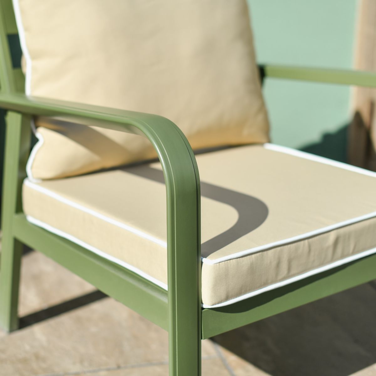 Close up of green metal arm detail on garden lounge set