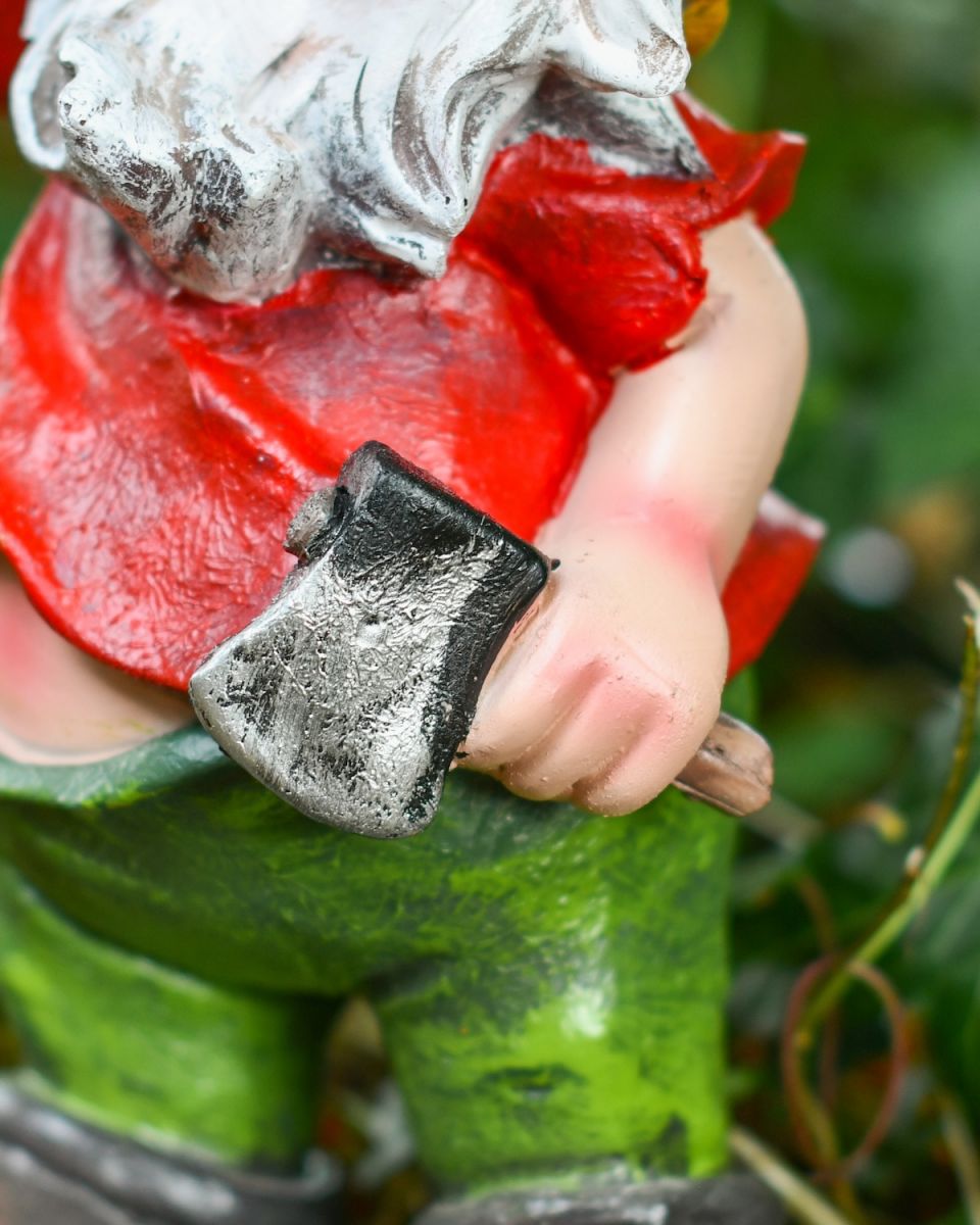 Close up of intricate axe detail on colourful gnome ornament