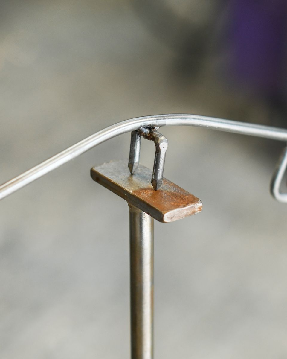 Close up of balancing element of recycled metal art sculpture
