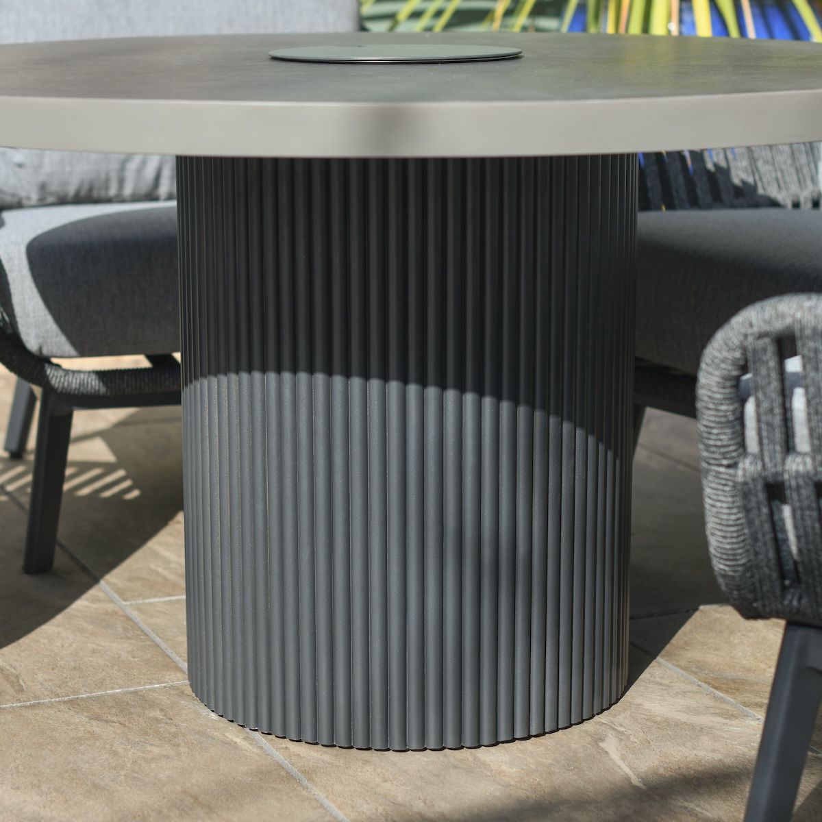 Close up of ribbed base detail on four seater garden table and chairs set
