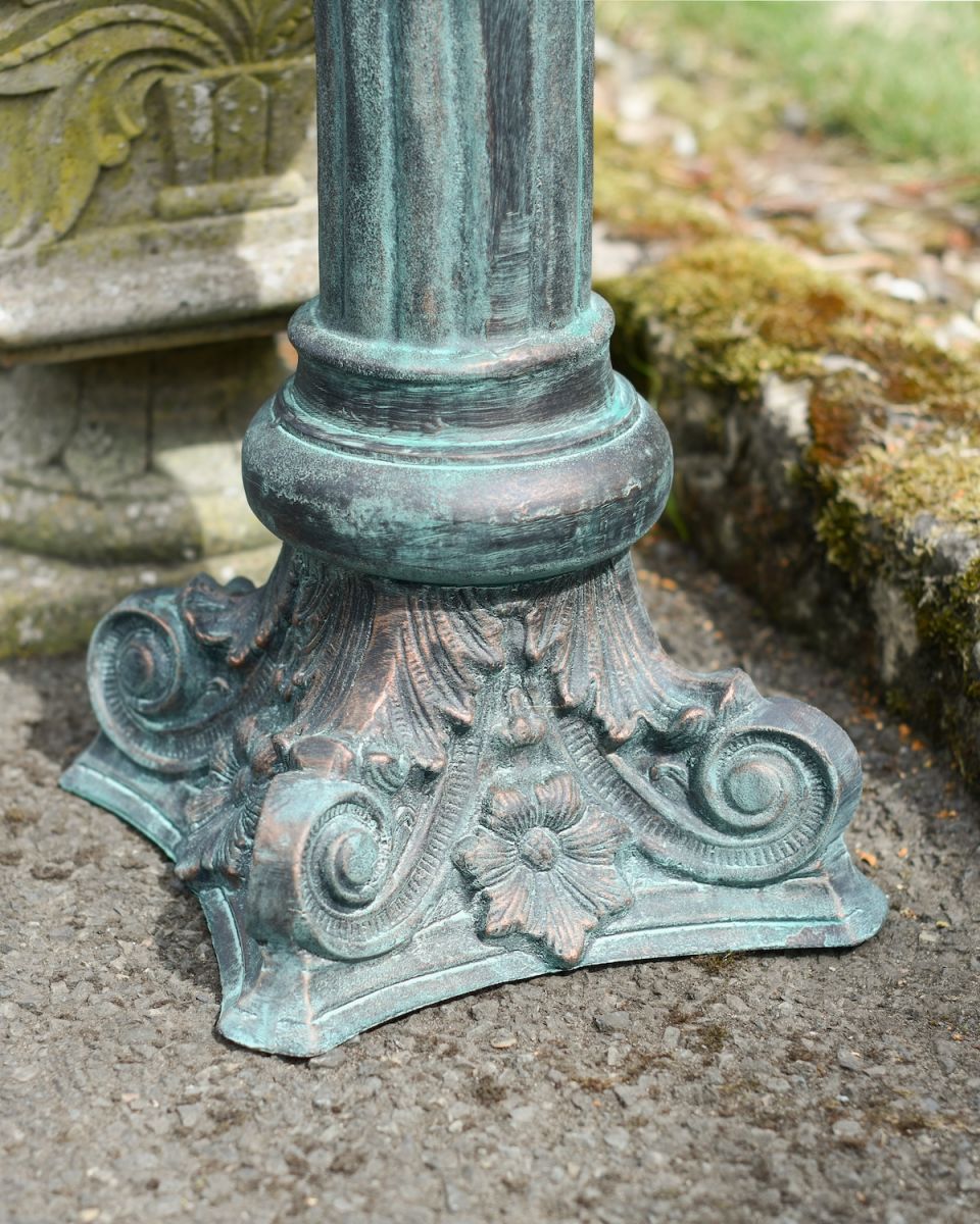 Close up of ornate base detail on garden plinth