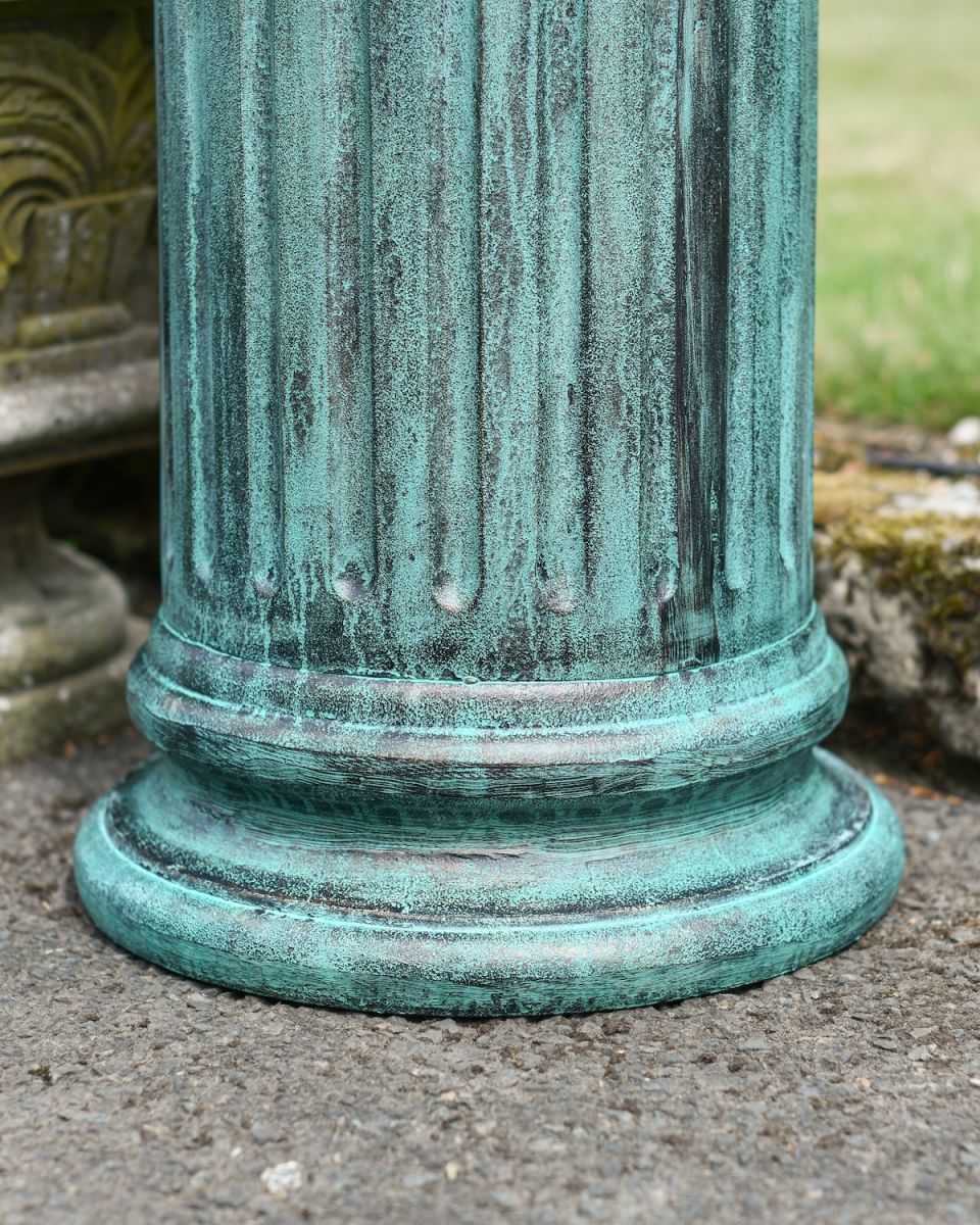 Close up of ornate base detail on garden plinth