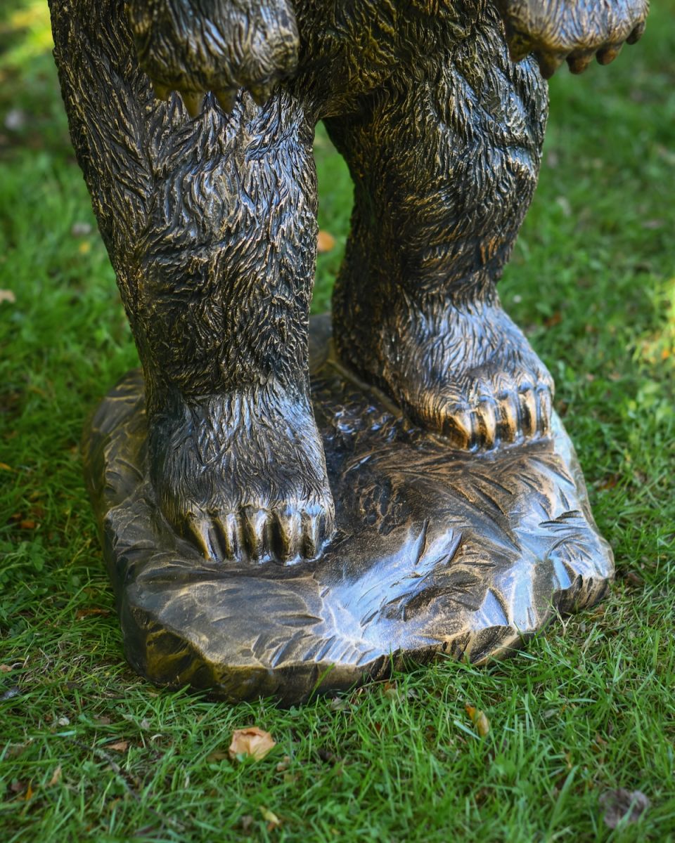 Close up of paw detail on bear garden statue