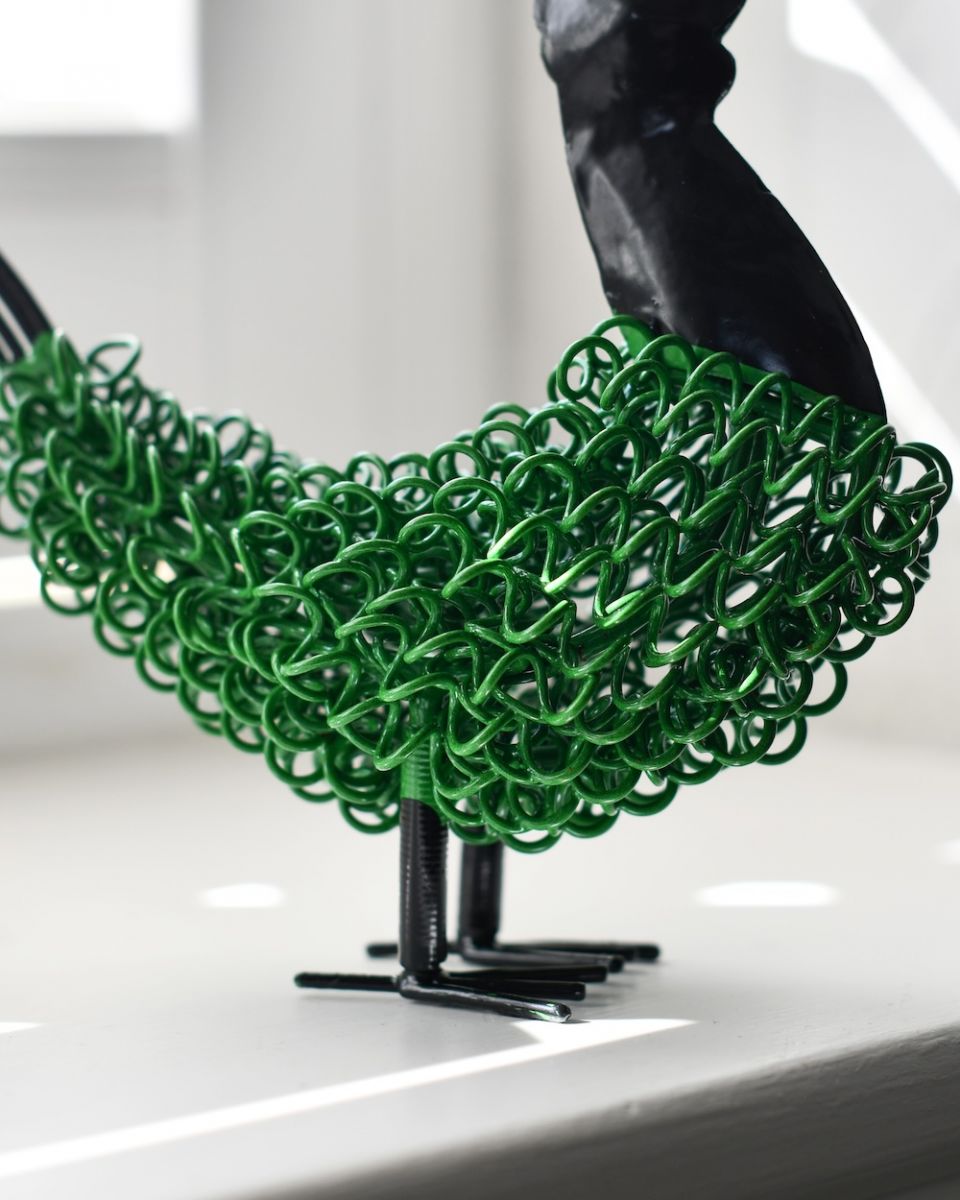 Close up of curly body detail on recycled cockerel sculpture