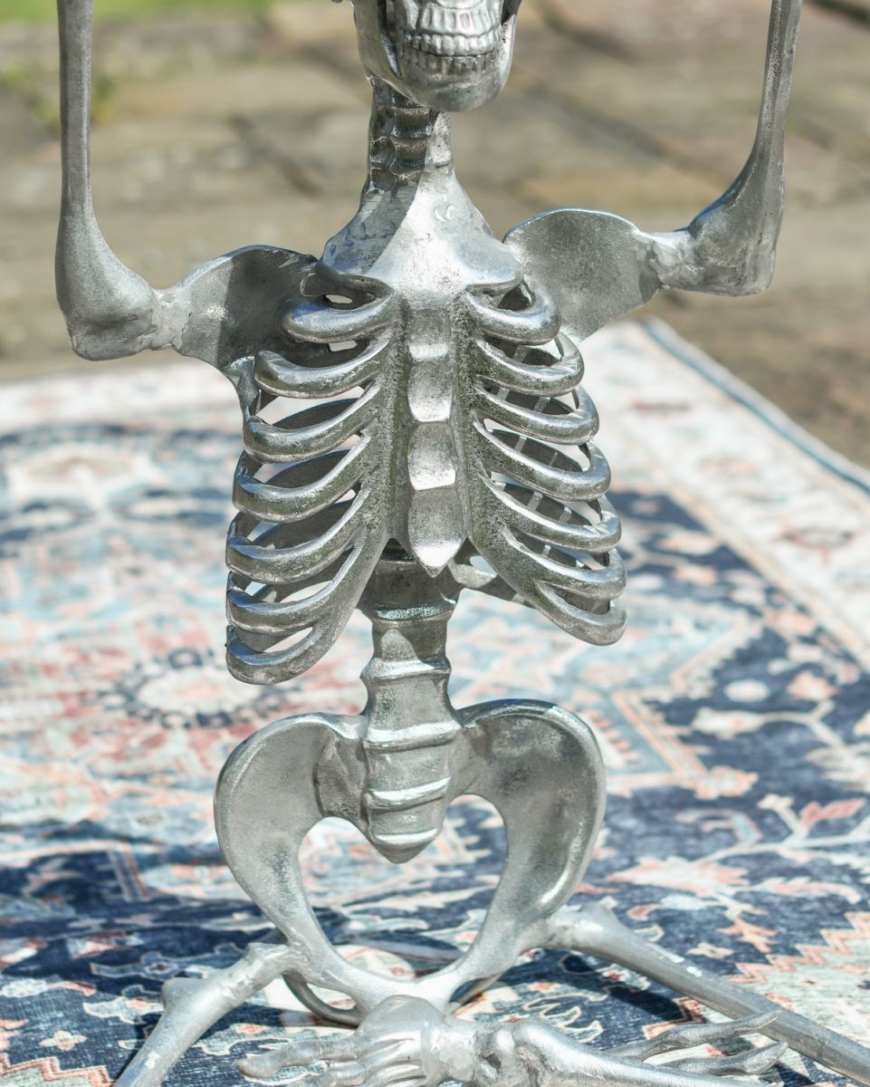 Close up of silver finish on yoga pose garden skeleton