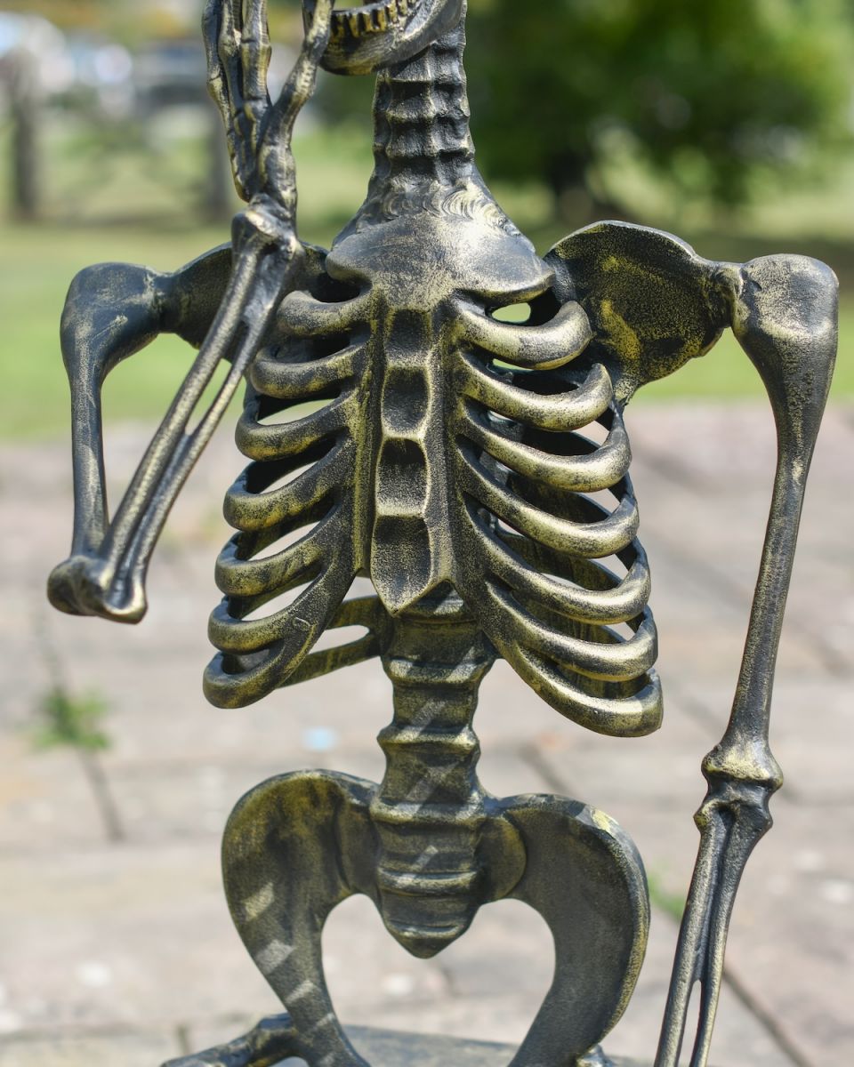 Close up of intricate body detail on skeleton outdoor statue