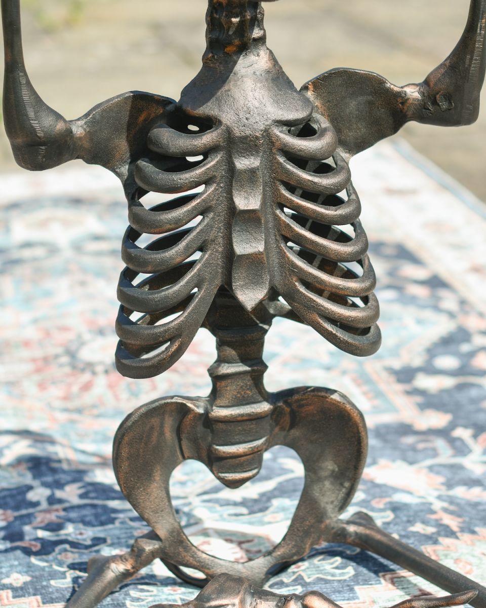 Close up of intricate rib detail on cast aluminium skeleton sculpture