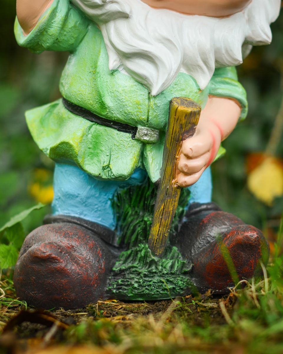 Close up of body detail on colourful outdoor gnome sculpture