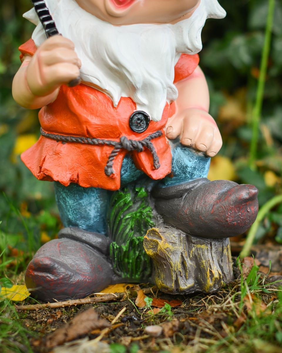 Close up of intricate clothes detail on garden gnome ornament