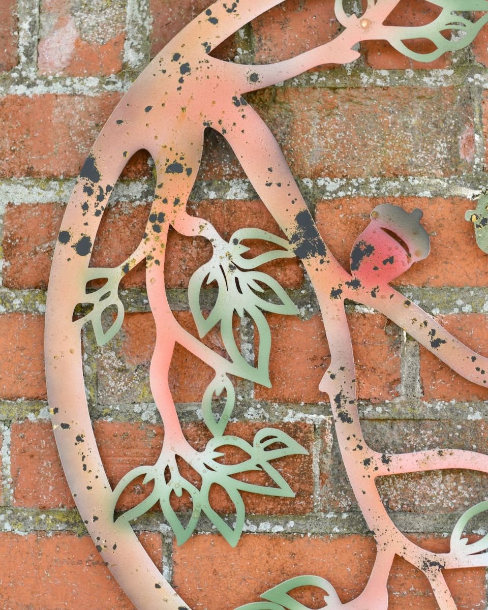Close up of rustic detail on colourful garden wall art