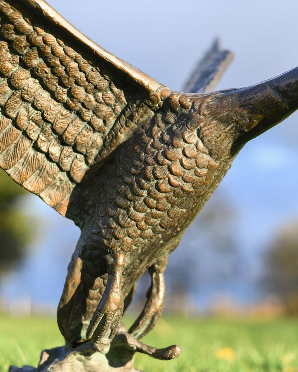 Close Up Of Detail On Cast Aluminum Flying Duck Garden Sculpture 