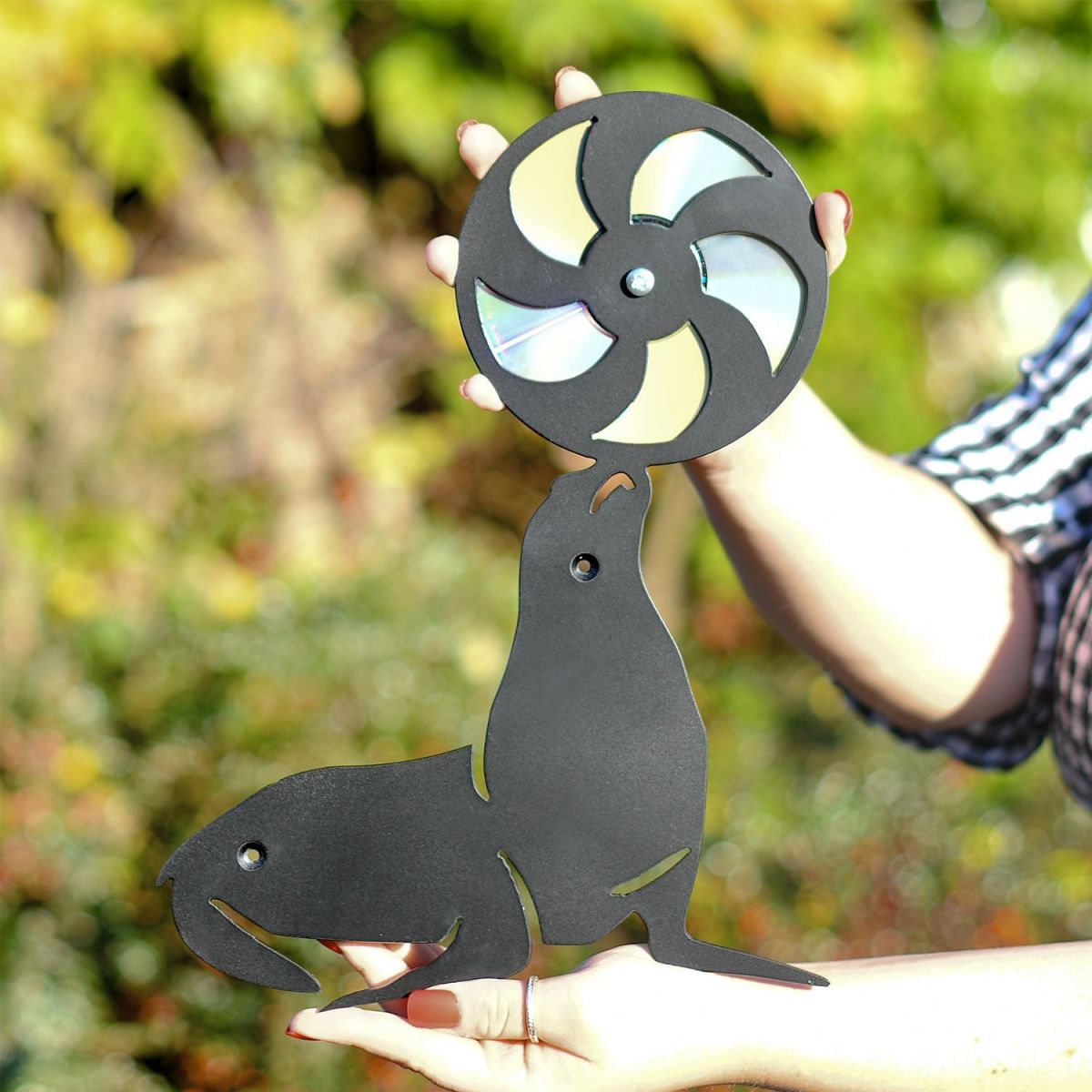 Close Up Of CD Seal With Ball Being Held