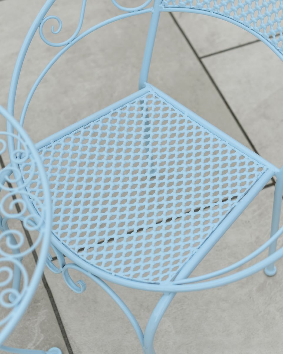 Close up of intricate seat detail on patio two seater bistro set Close up of intricate seat detail on patio two seater bistro set
