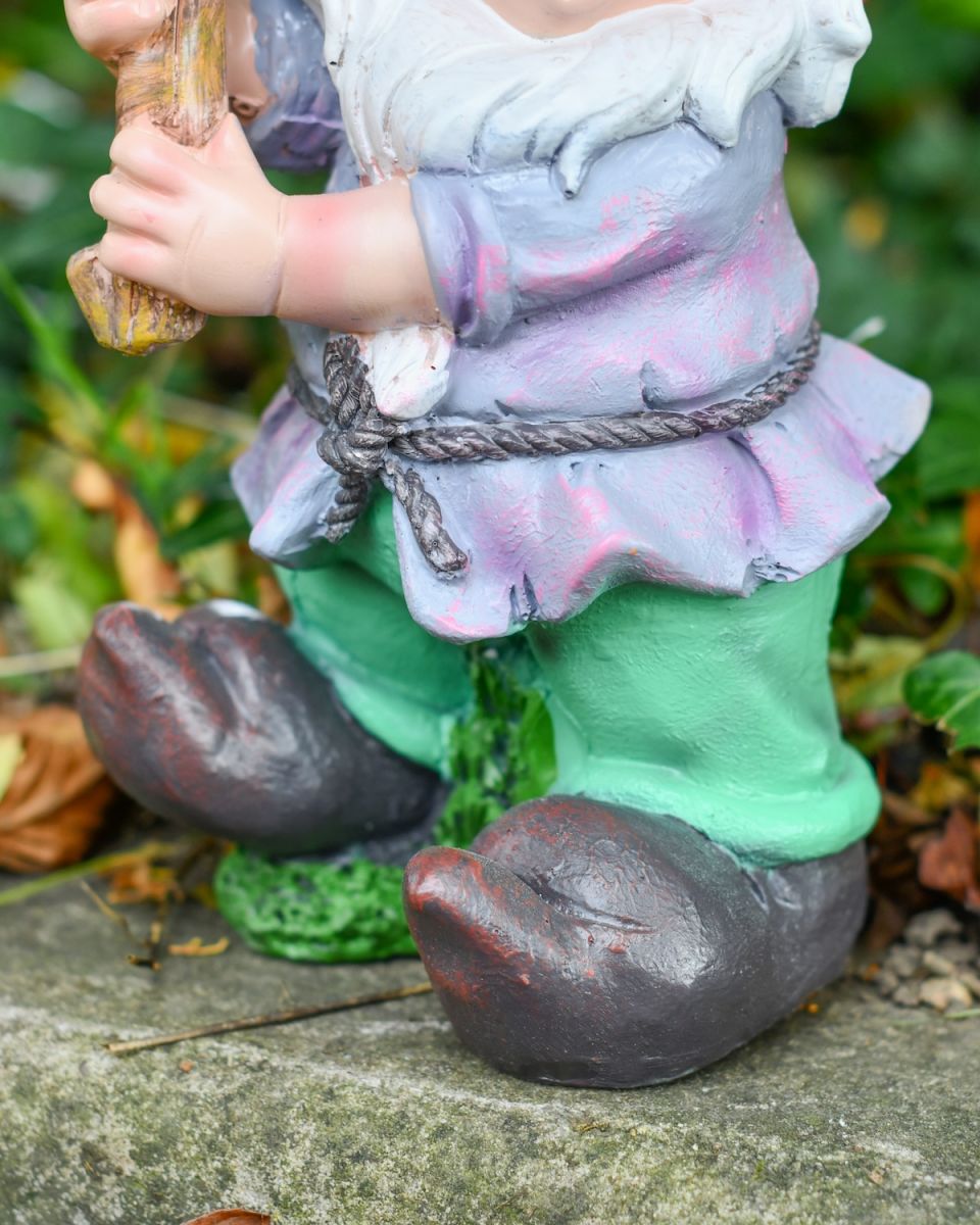 Close up of clothes detail on colourful outdoor gnome sculpture