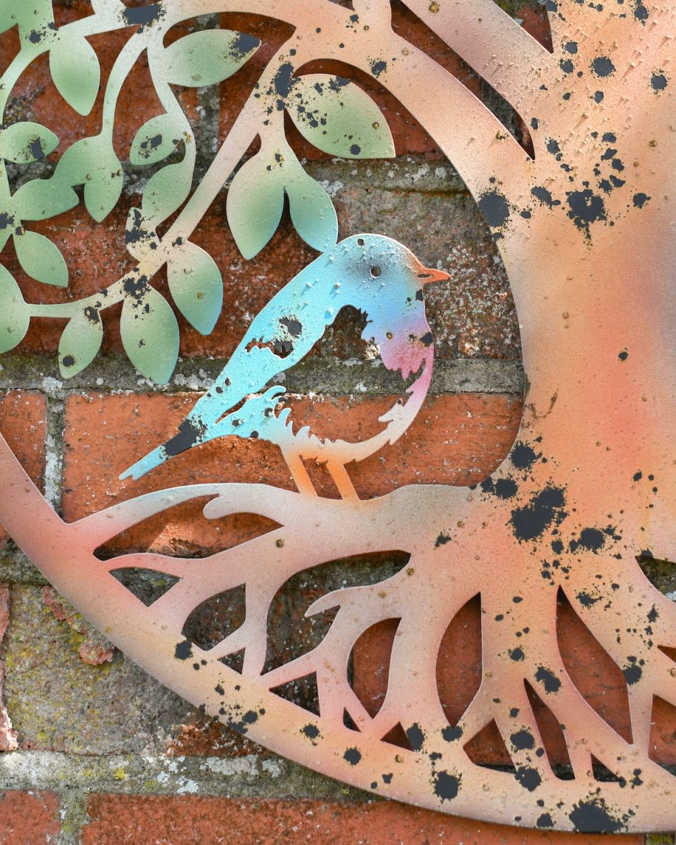 Close up of colourful bird detail on outdoor wall art