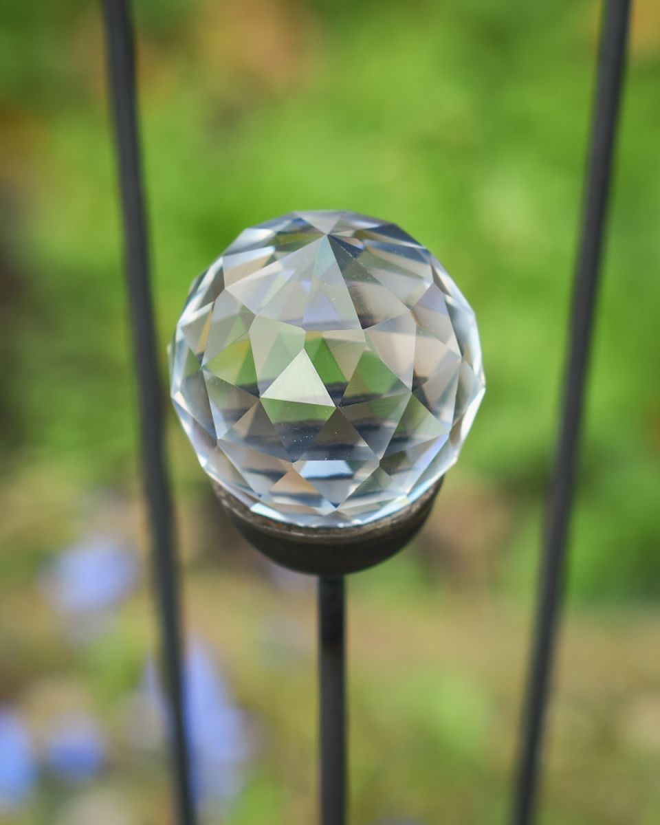close up of suncatcher detail on plant pot garden stake