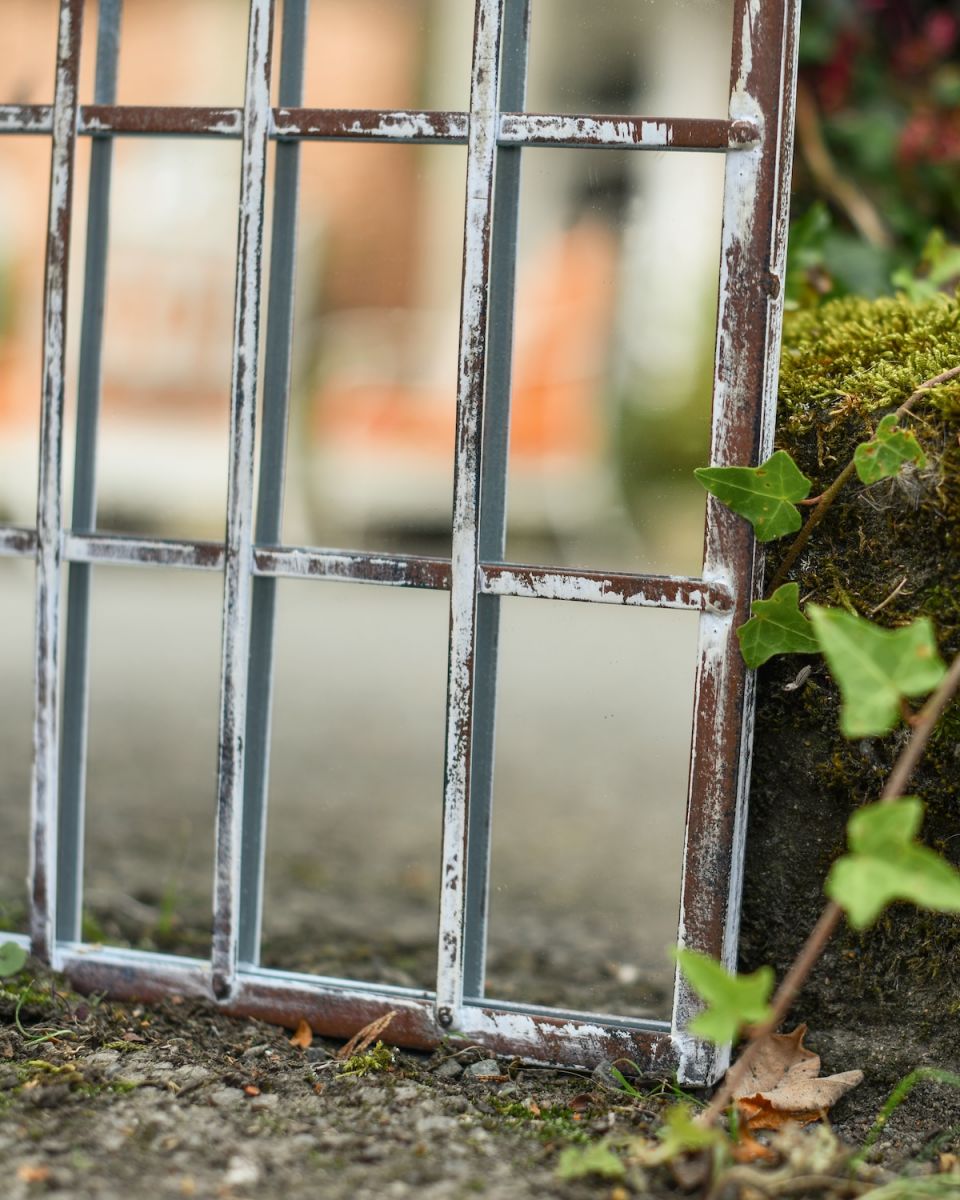 Close up of detail on garden mirror Close up of detail on garden mirror