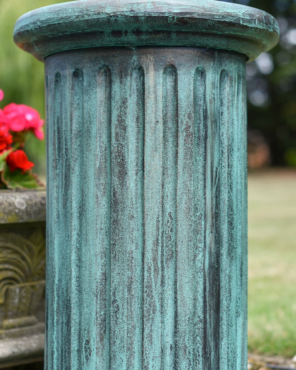 Close up of verdigris finish on garden plinth