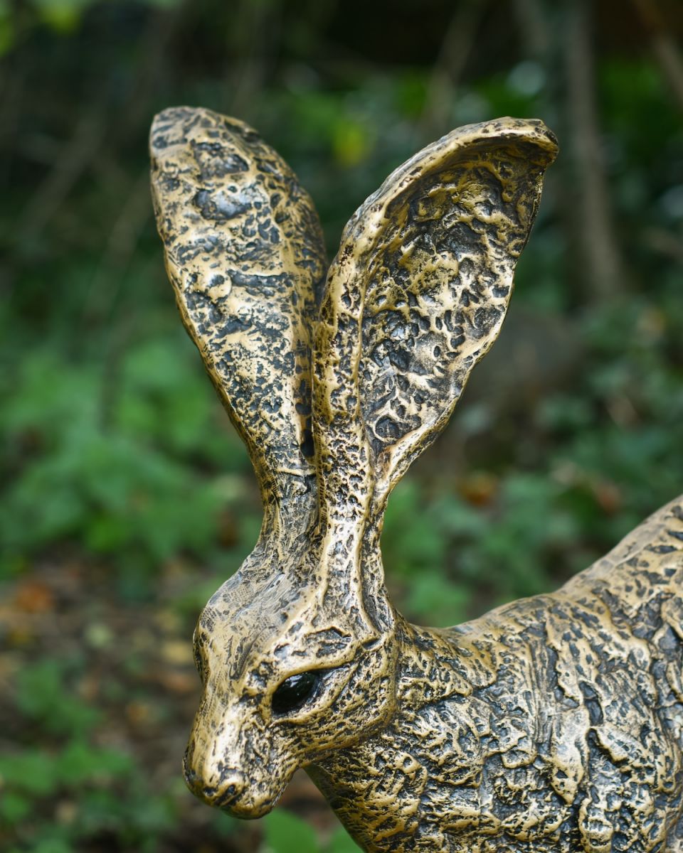 Close up of intricate hare ear detail on garden sculpture