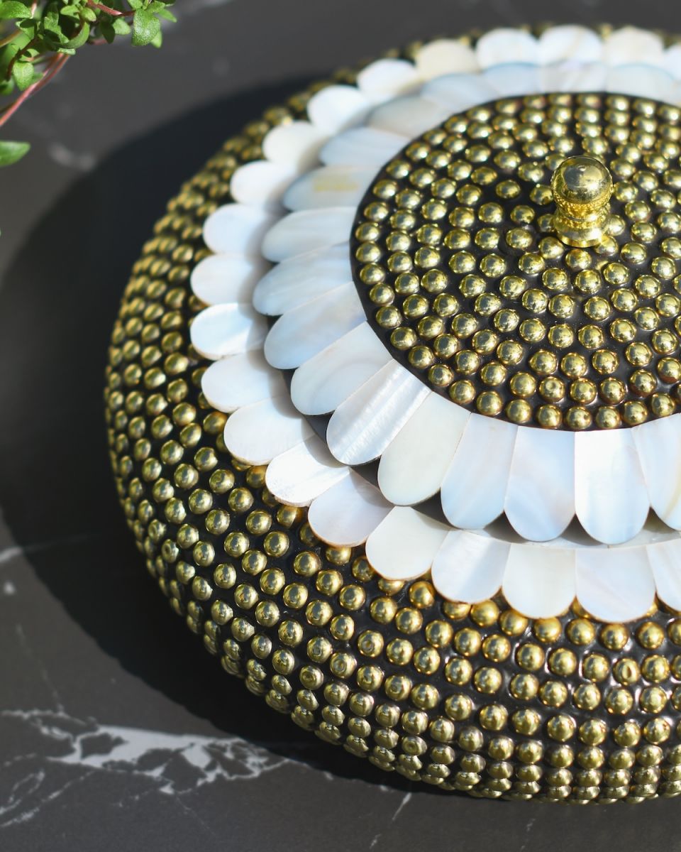 Close up of intricate brass detailing on trinket bowl
