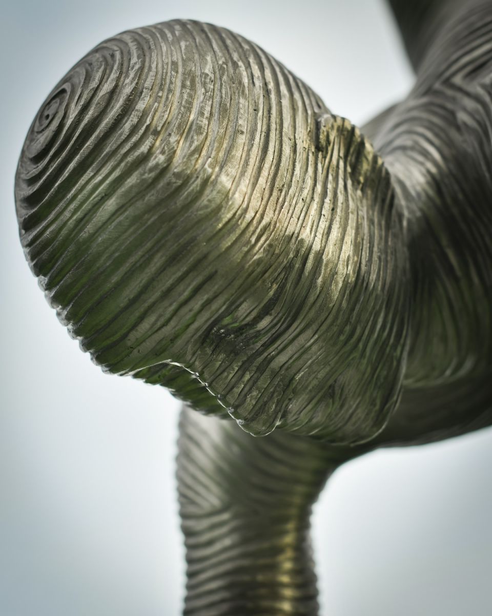 Close up of abstract face detail on garden art sculpture