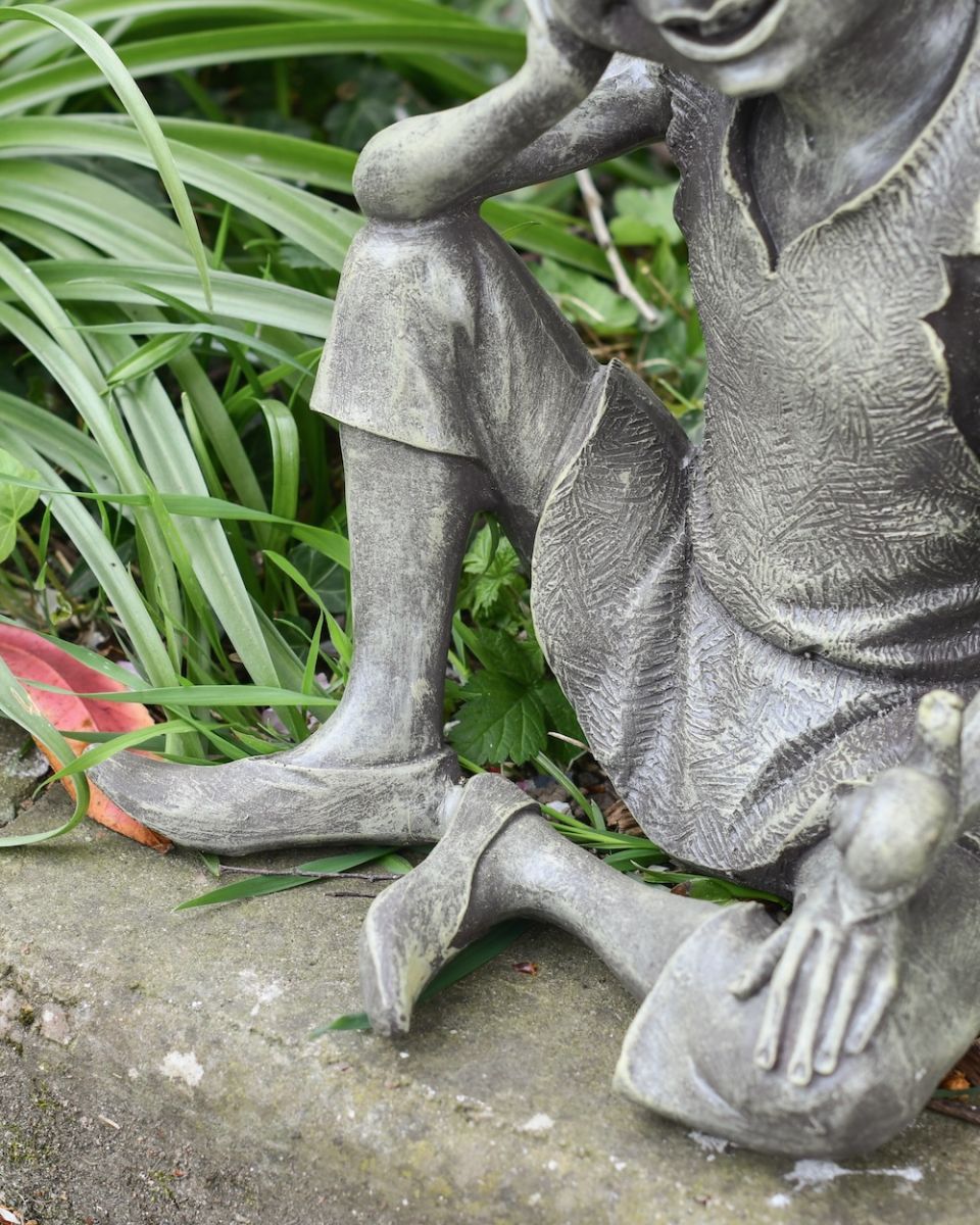 close up of leg and feet detail on garden statue