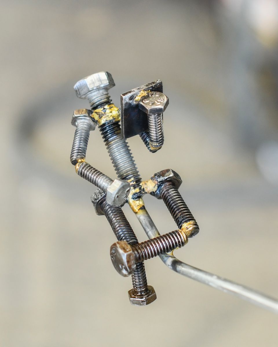 Close up of figure detail on scrap metal home decor sculpture Close up of figure detail on scrap metal home decor sculpture