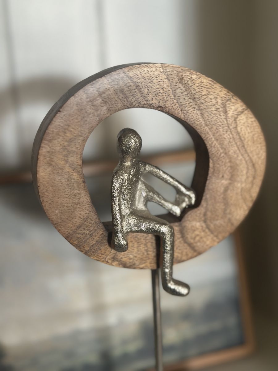 Close up of silver figure on home decor art sculpture