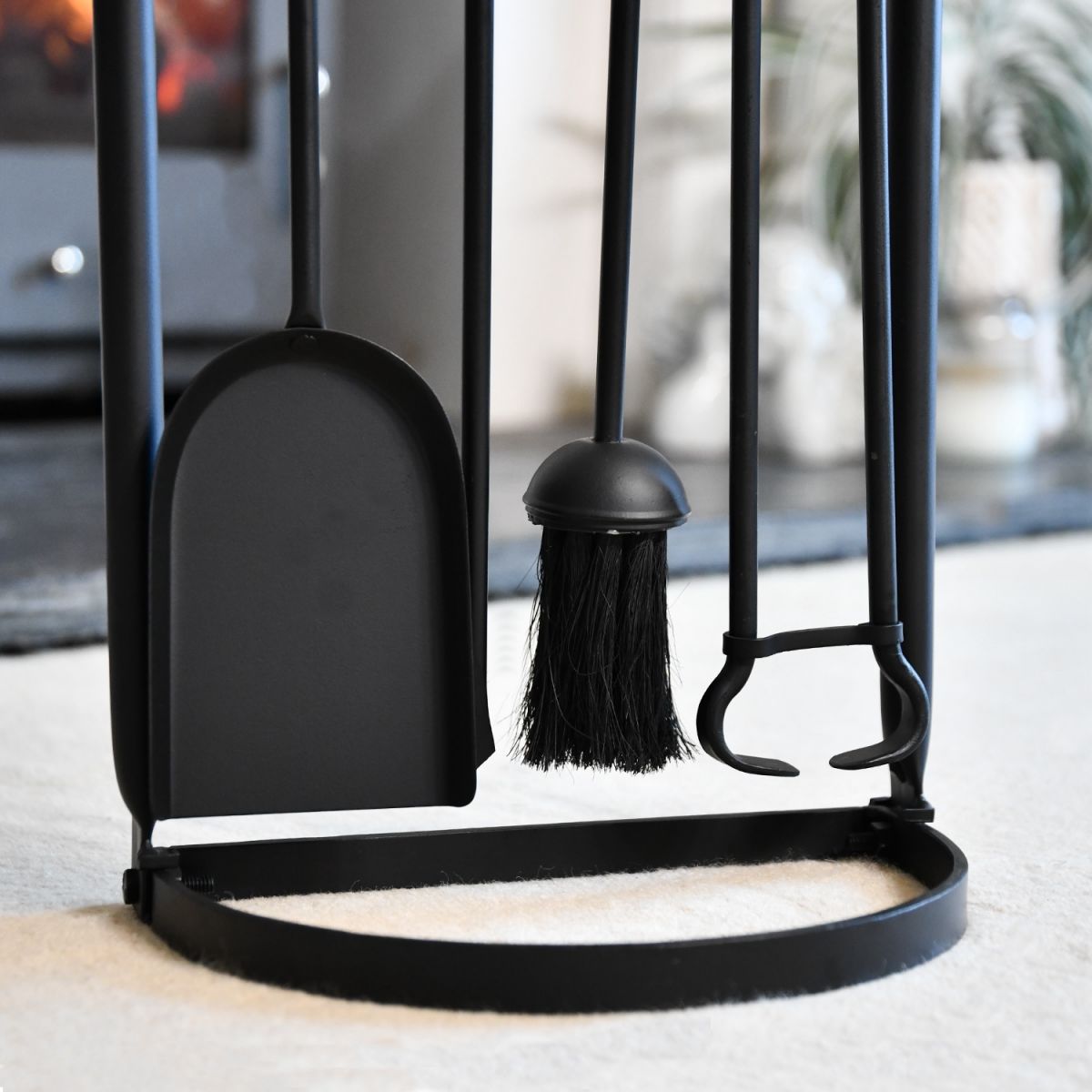 Close up of freestanding base on contemporary wood burner companion set Close up of freestanding base on contemporary wood burner companion set