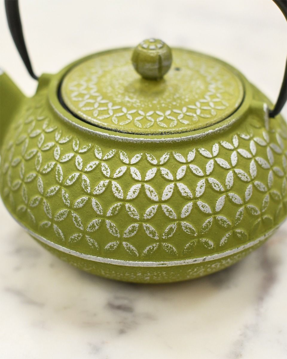 Close up of Green and Silver Embossed Cast Iron Teapot 