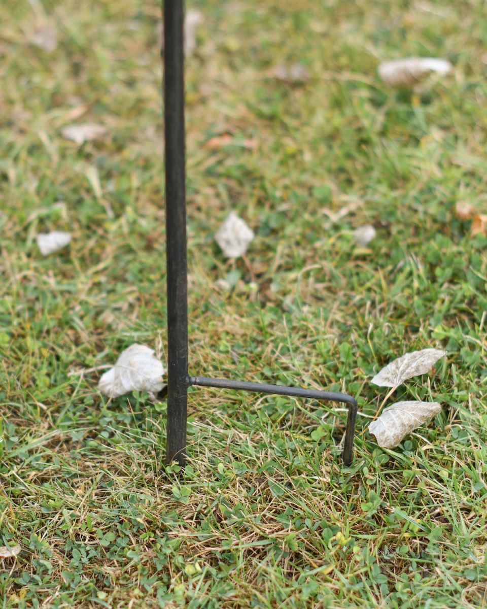 Close up of ground spike detail on balancing garden ornament