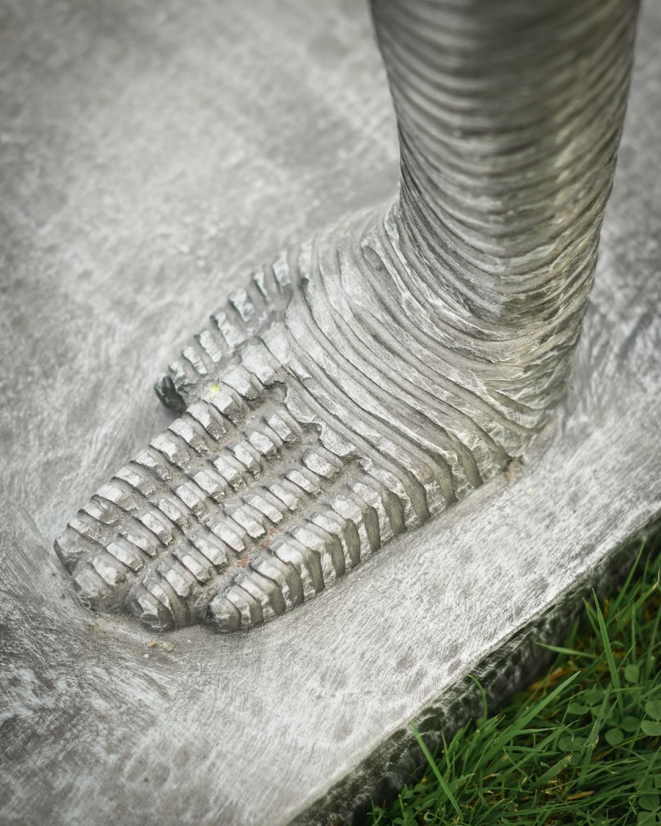 Close up of intricate hand detail on handstand art outdoor sculpture