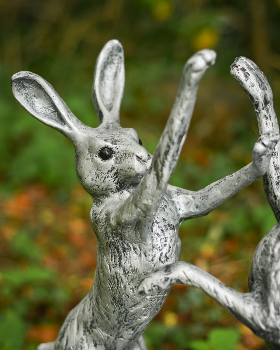 Close up of intricate detail on boxing hares garden sculpture