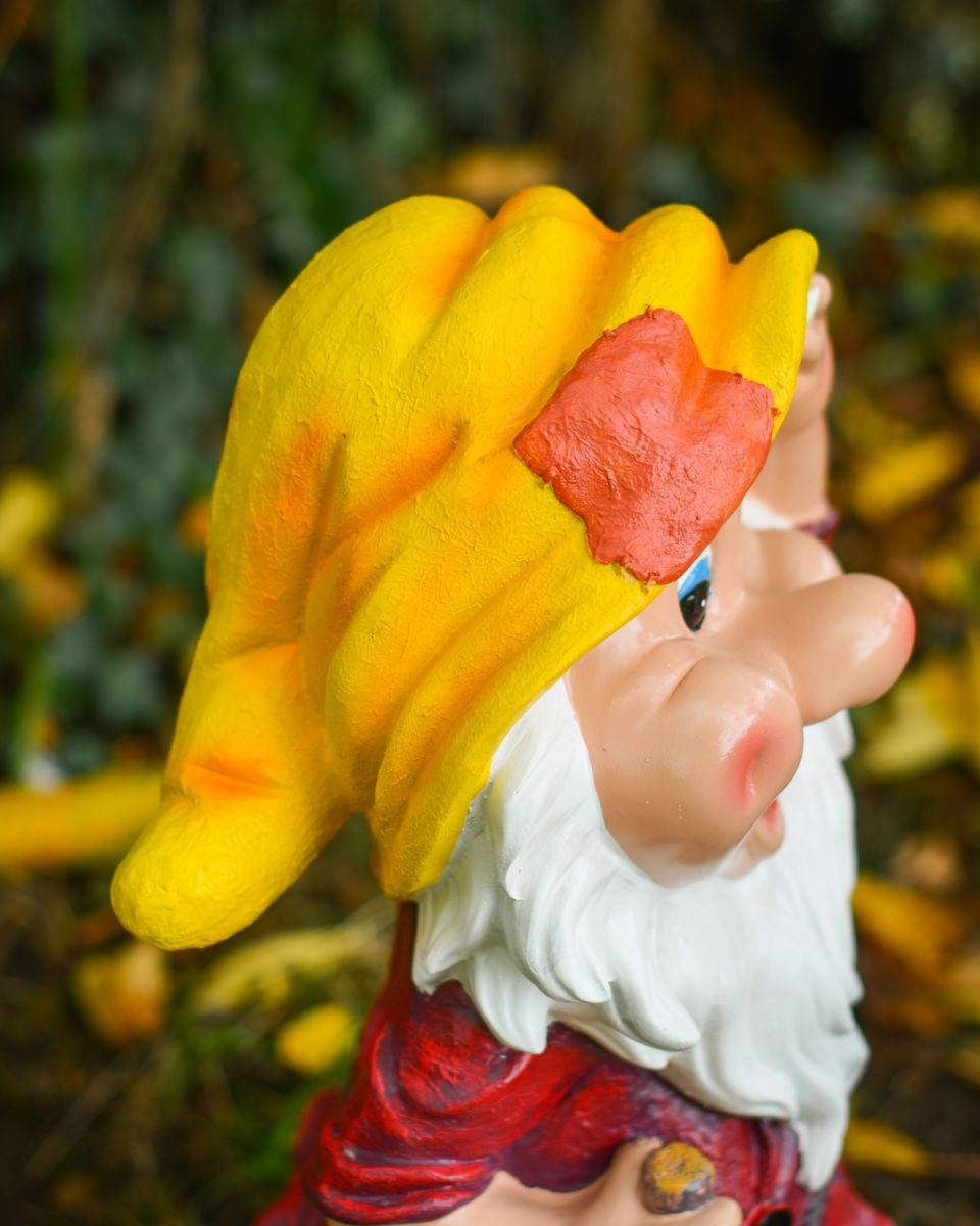 Close up of intricate hat detail on colourful garden gnome sculpture Close up of intricate hat detail on colourful garden gnome sculpture