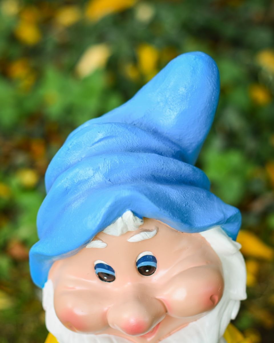 Close up of intricate hat detail on colourful garden gnome ornament Close up of intricate hat detail on colourful garden gnome ornament