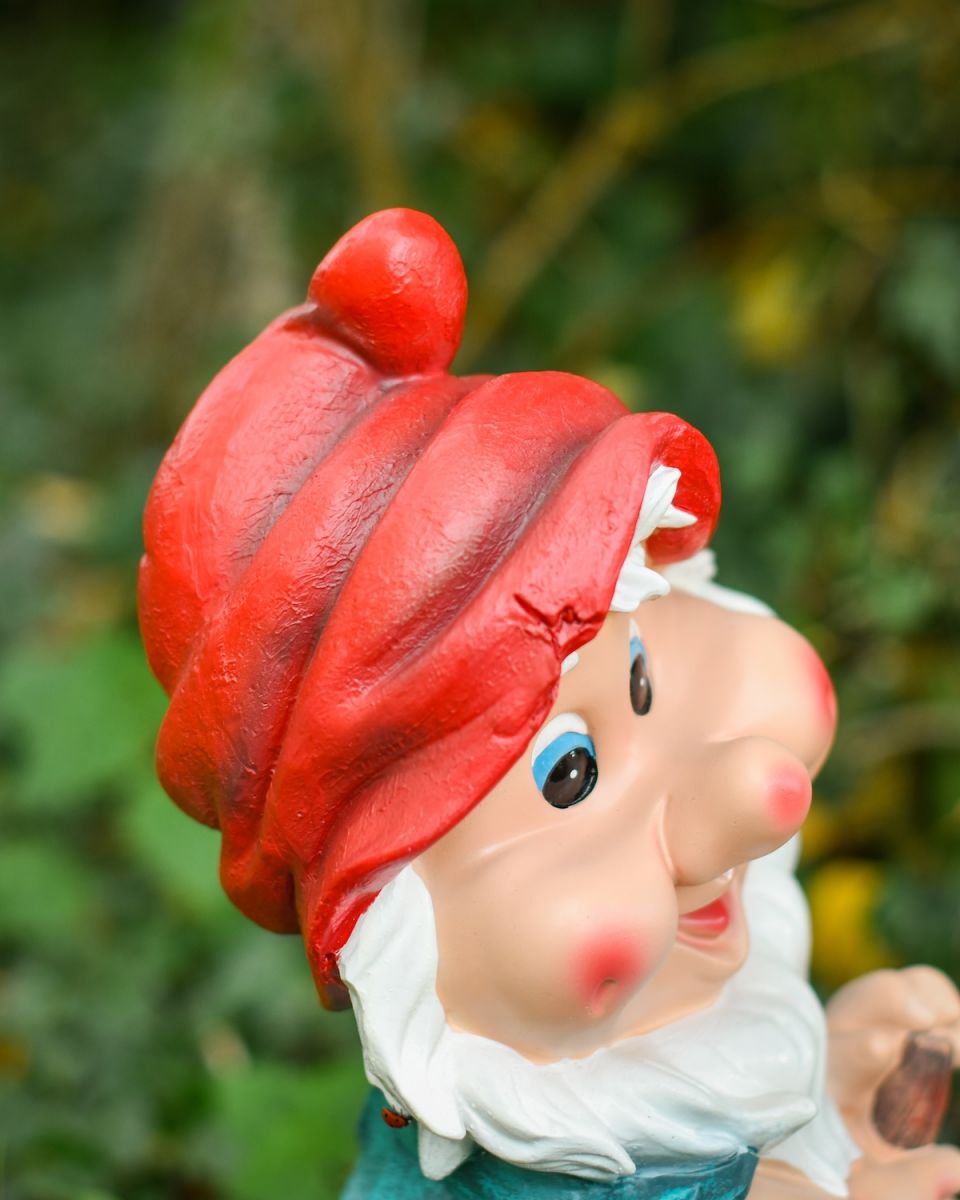 Close up of intricate hat detail on colourful outdoor gnome sculpture
