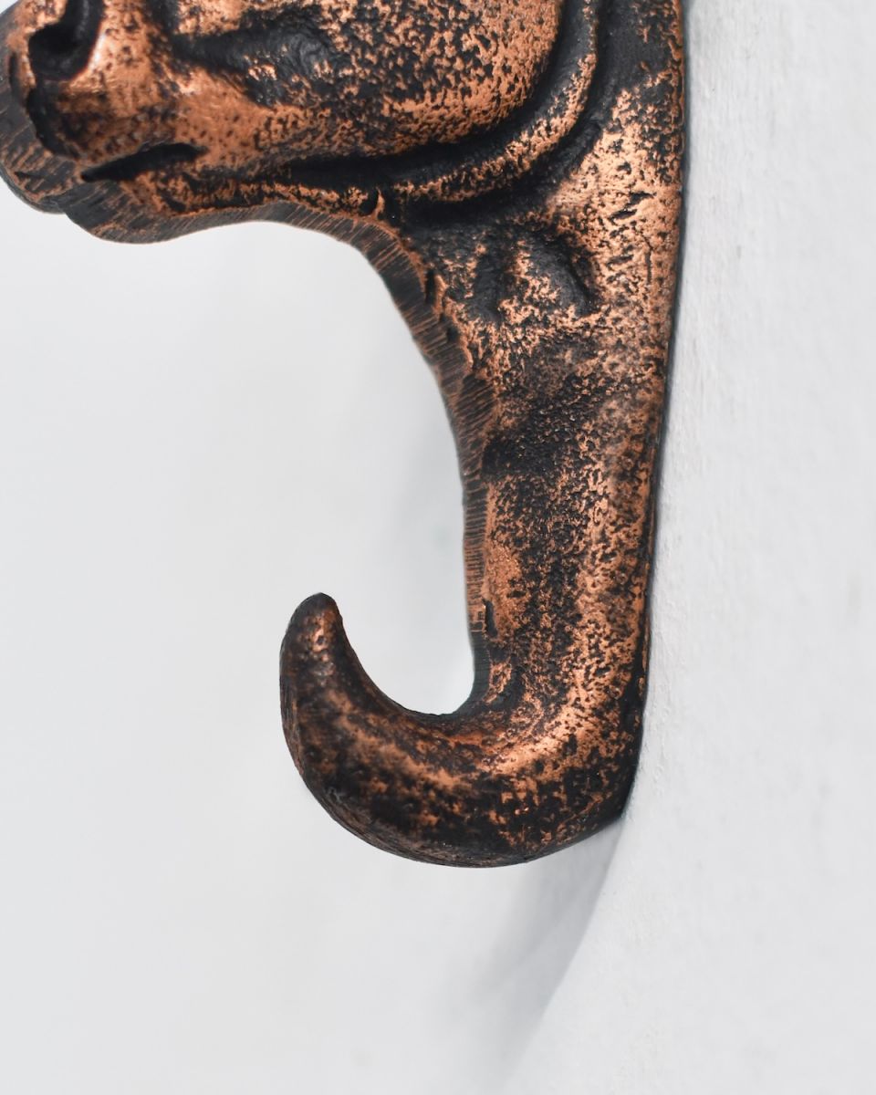 Close up of sturdy hook detail on copper detail animal bust coat hook