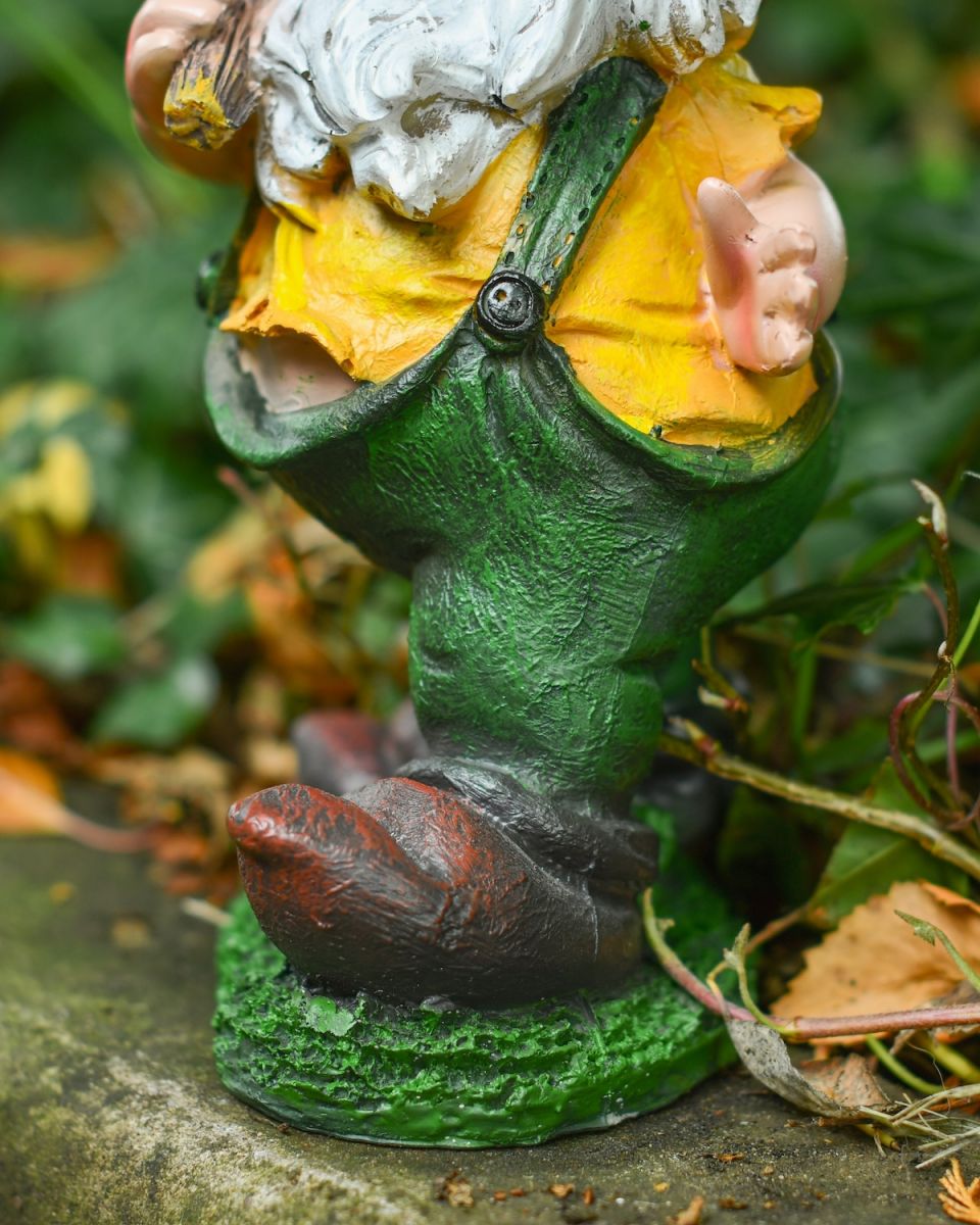 Close up of intricate detail on colourful garden gnome ornament