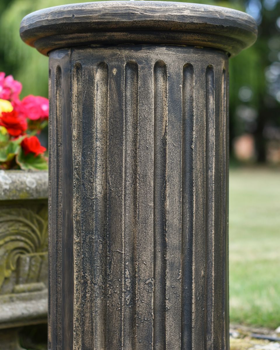 Close up of intricate detail on garden plinth