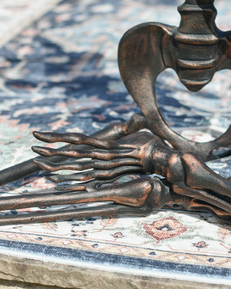 Close up of intricate feet detail on yoga pose skeleton sculpture