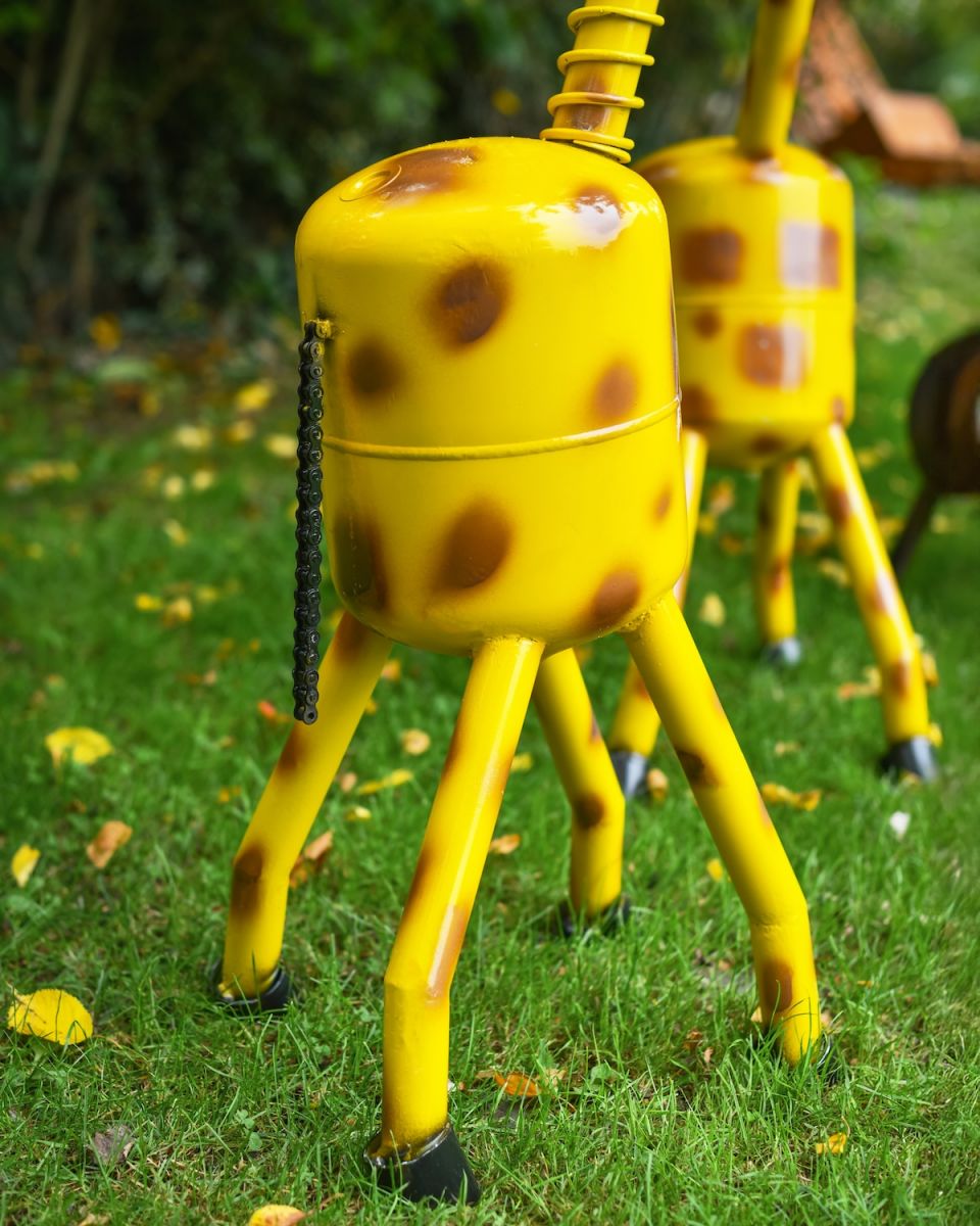 Close up of tail and leg detail on outdoor giraffe sculpture