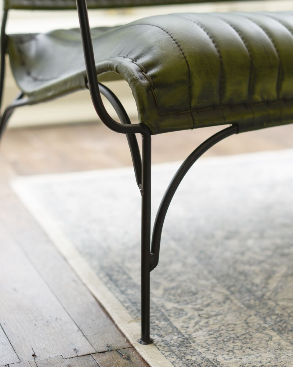 Close up of iron leg detail on Traditional Green Leather and Iron Two Seater Chair