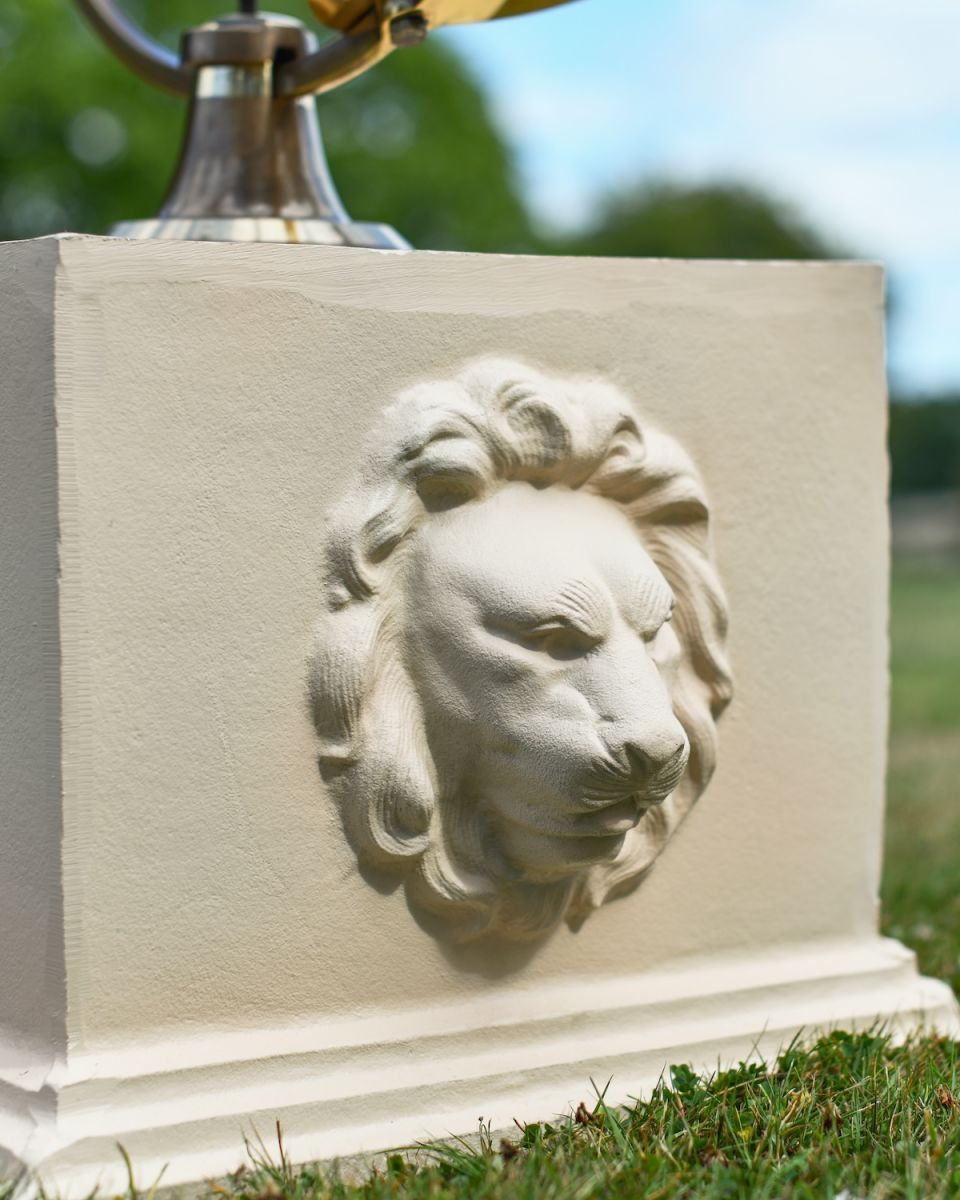 Close up of lion head detail on garden column