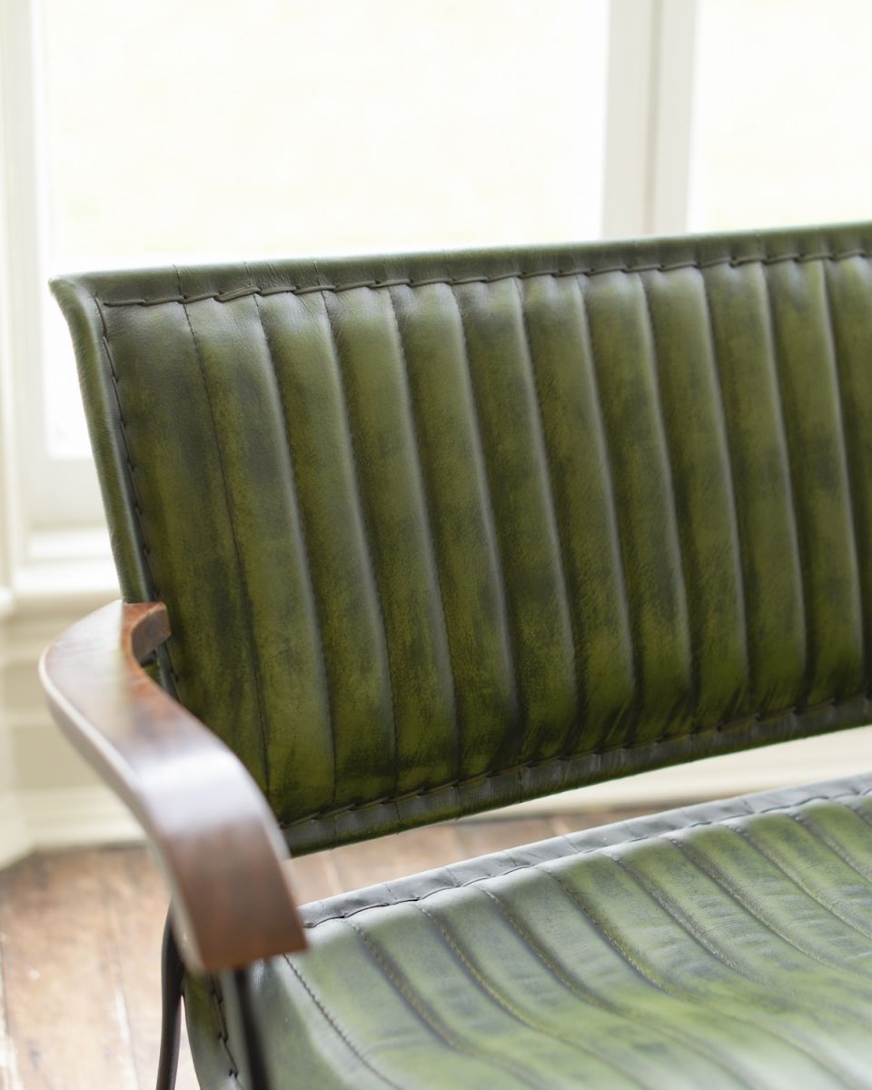 Close up of intricate backrest detail on two seater leather chair